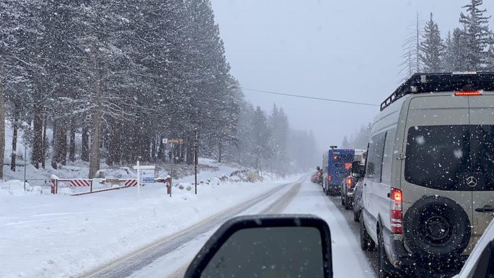 Standstill traffic in Big Cottonwood Canyon during a winter snowstorm.