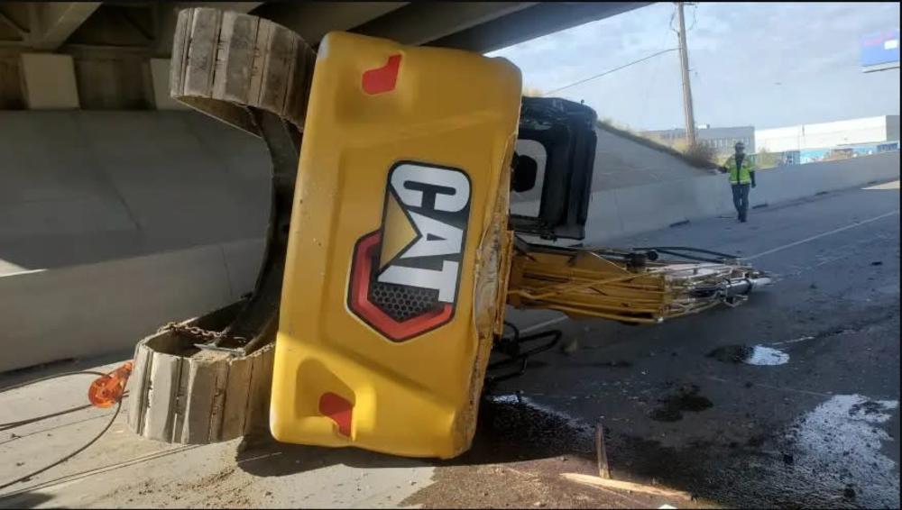 Excavator underneath I-215 w 2700 S bridge after collision