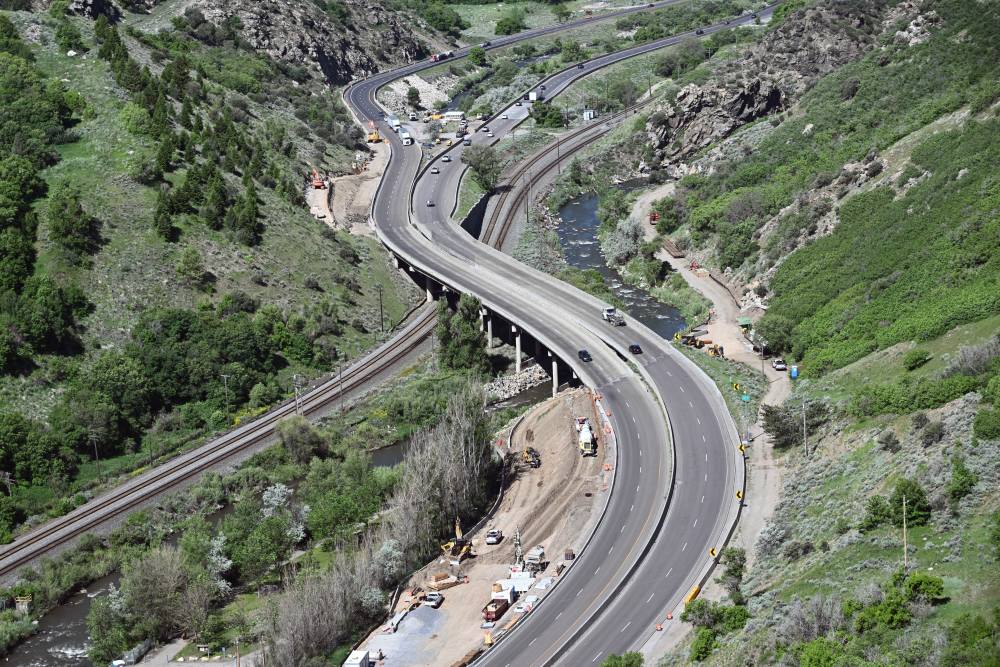 An aerial view of the I-84 project area where the bridge curves over the Weber River.
